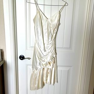 Ivory spaghetti strap asymmetrical w/zipper on left side with rose complimenting